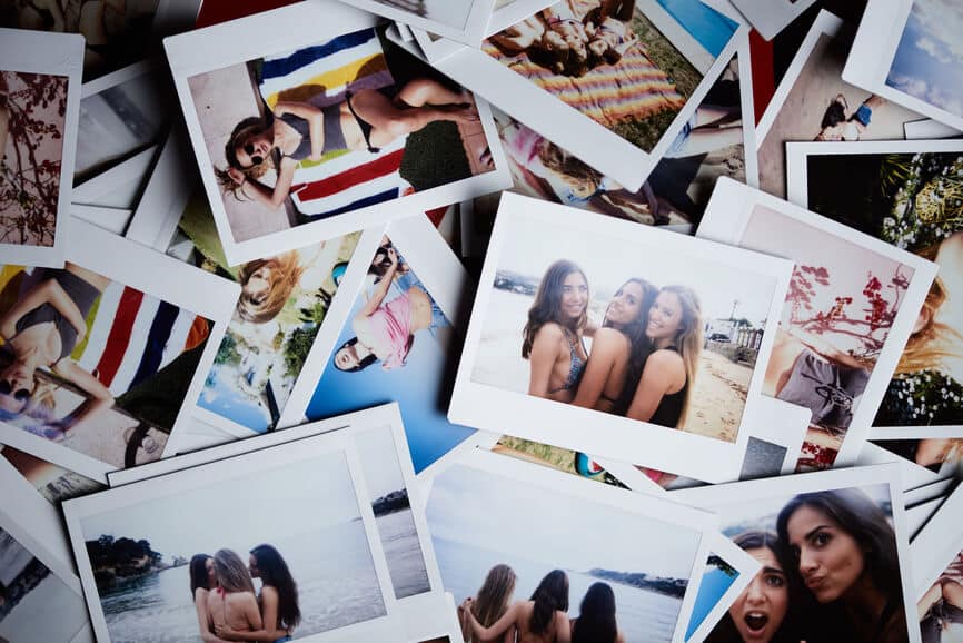 Polaroid pictures spread out on table